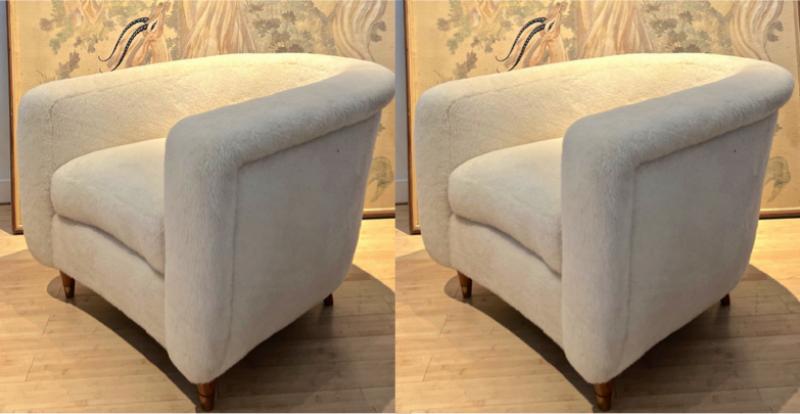 Jean Royere pair of lounge chairs covered in wool faux fur