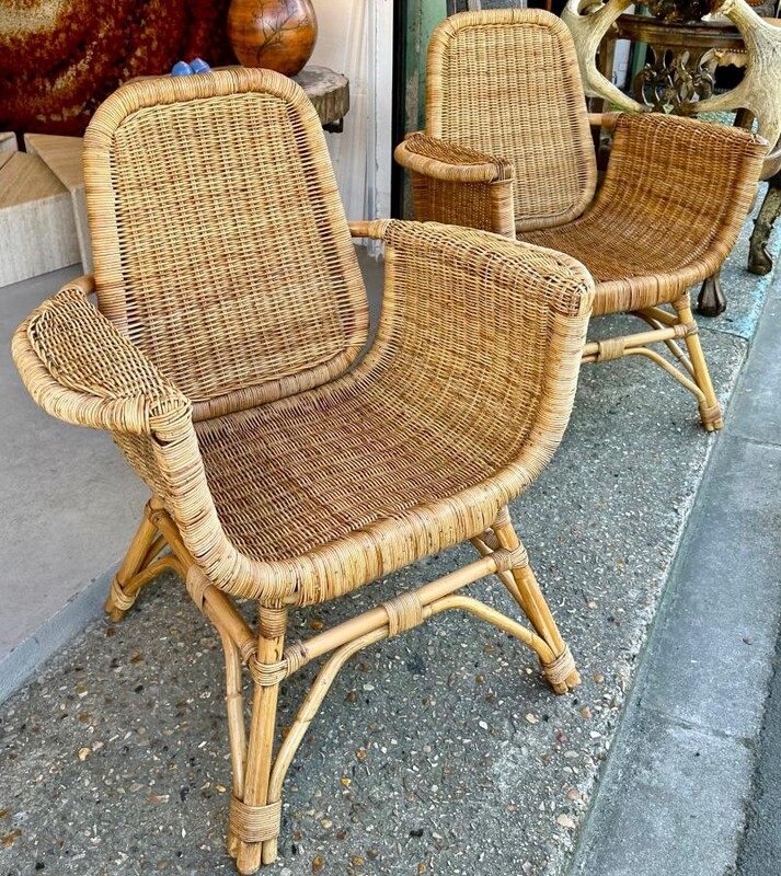 Louis Sognot refined pair of rattan arm chairs in good vintage