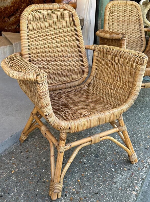 Louis Sognot refined pair of rattan arm chairs in good vintage