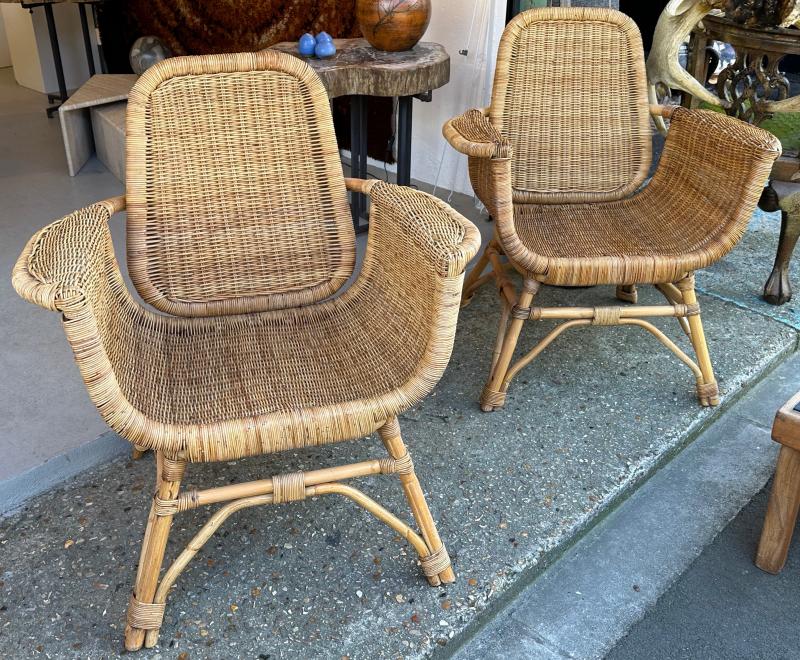 Louis Sognot refined pair of rattan arm chairs in good vintage